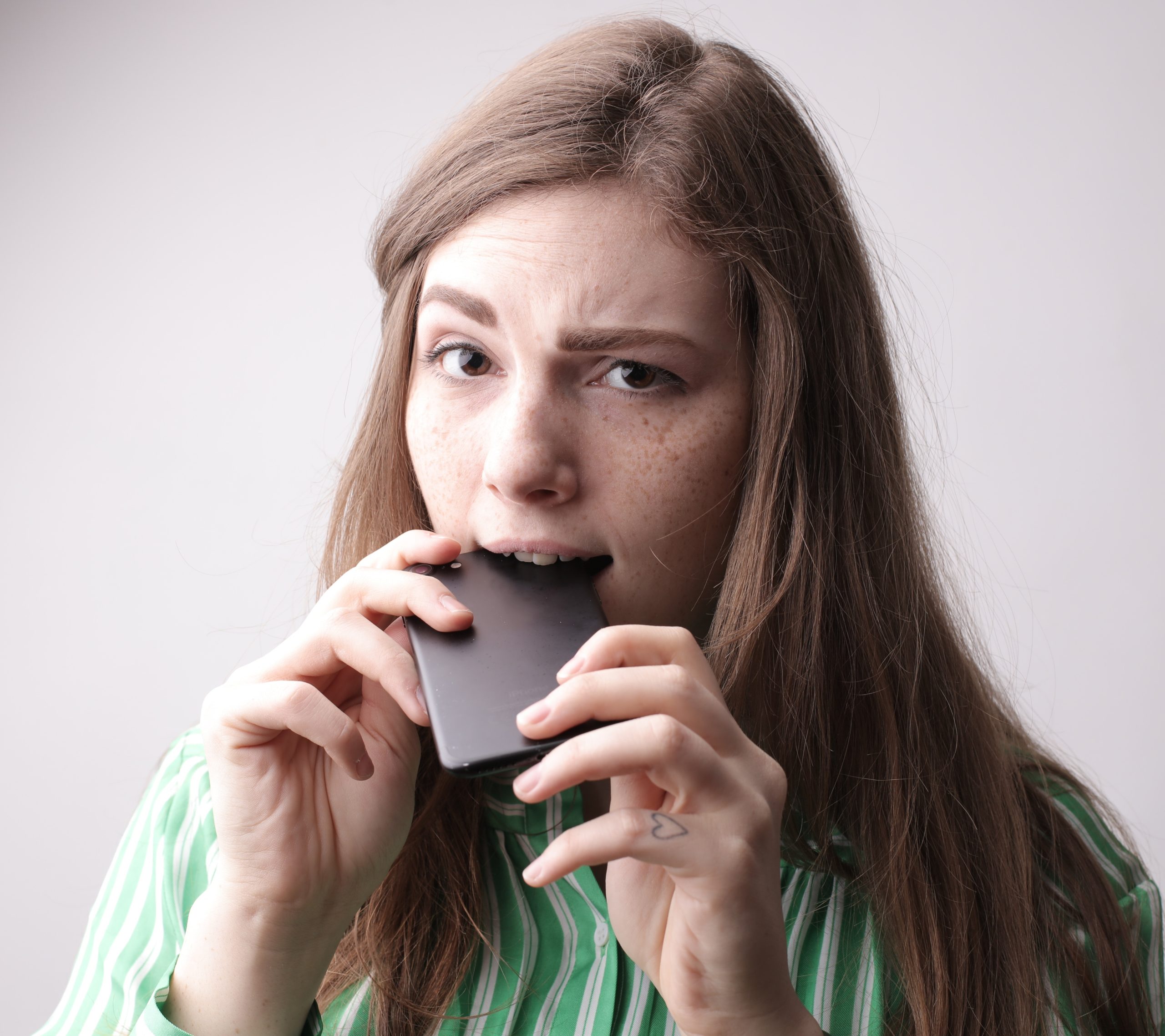 Stress cues like nail-biting make you more likeable, says study